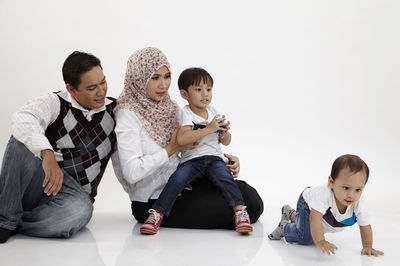 Happy family against white background