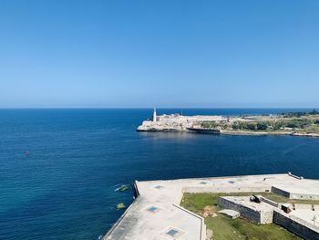 Scenic view of sea against blue sky. port entrance at havana.