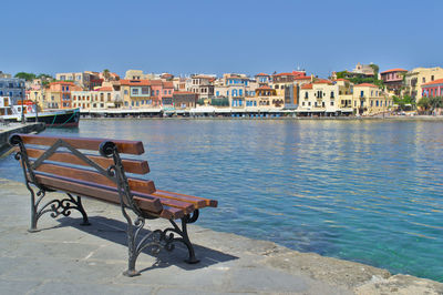 Scenic view of sea against buildings in city