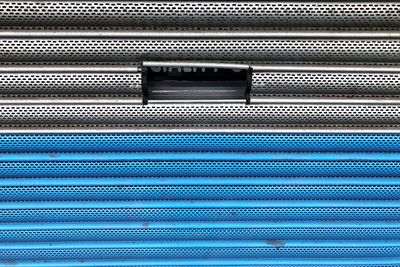 Full frame shot of blue metal grate