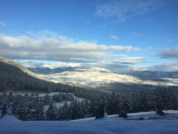 Scenic view of landscape against sky during winter