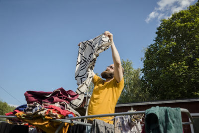Man folding laundry