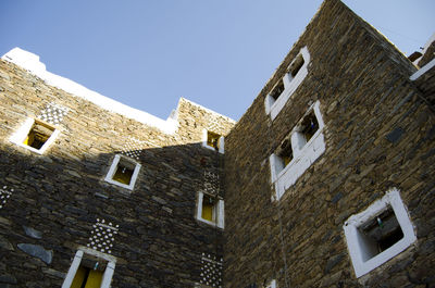 Low angle view of old building against clear sky