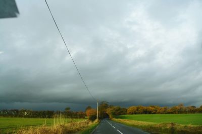 View of road against cloudy sky