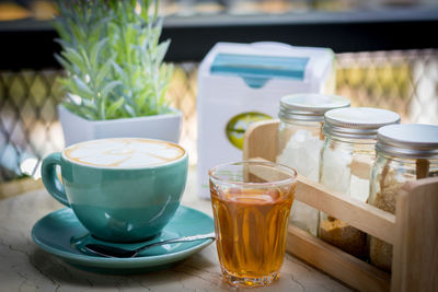 Close-up of drinks on table at sidewalk cafe 