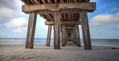 View of pier over sea against sky