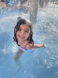 High angle view of boy swimming in pool