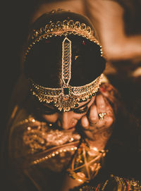 Close-up of woman hand holding cross