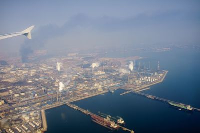 Aerial view of illuminated city against sky