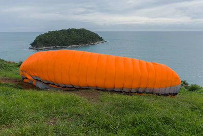 Scenic view of sea against cloudy sky