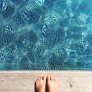 Low section of person at poolside