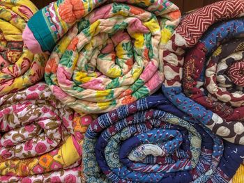 Full frame shot of multi colored blankets in market for sale