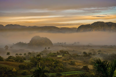 Scenic view of landscape against sky during sunset