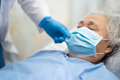 Midsection of women wearing mask