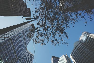 Low angle view of tall buildings against clear sky