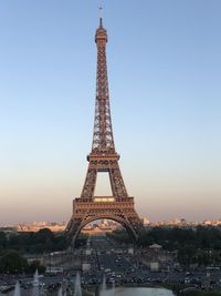 Tower against sky during sunset in city