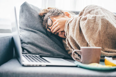 Woman using laptop at home