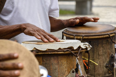 Percussionist playing atabaque during afro-brazilian capoeira presentation in  pelourinho, salvador