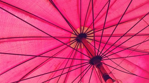 Low angle view of pink umbrella