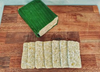 High angle view of bread on cutting board