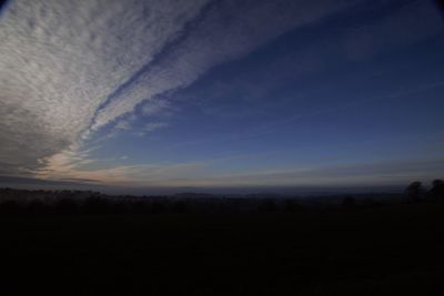 Scenic view of silhouette landscape against sky during sunset