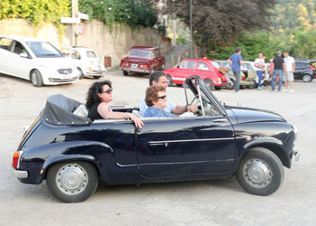 View of people sitting on street