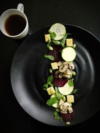 High angle view of fruits in plate on table