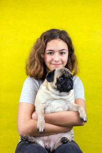 Portrait of a young woman with dog