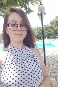 Portrait of a smiling young woman in swimming pool