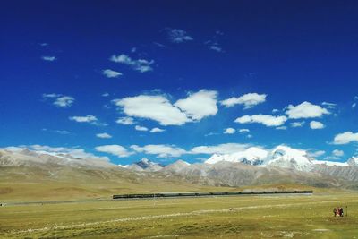 Scenic view of mountains against cloudy sky