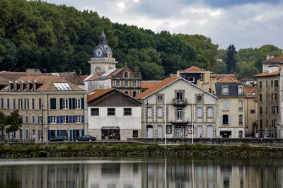 Buildings by river nive at saint-jean-pied-de-port