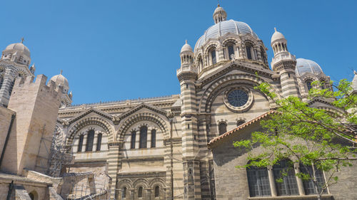 Low angle view of historic building against clear sky