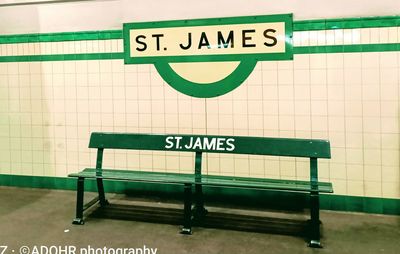 Information sign on wall at subway station