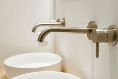 Close-up of faucet in bathroom