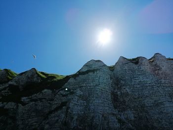 Low angle view of rock formation against sky