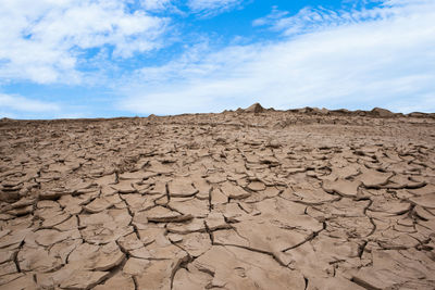 Dry cracked ground with the sky. drought concept.
