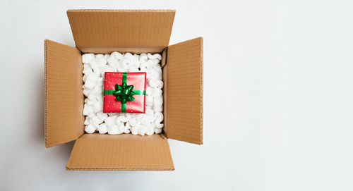 Directly above shot of christmas decorations on white background