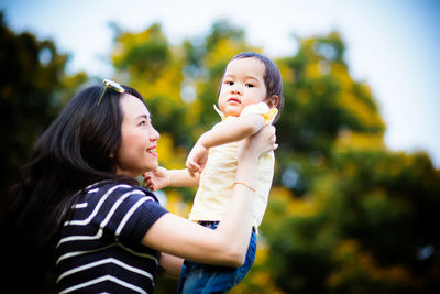 Side view of mother and daughter