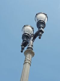 Low angle view of statue of street light