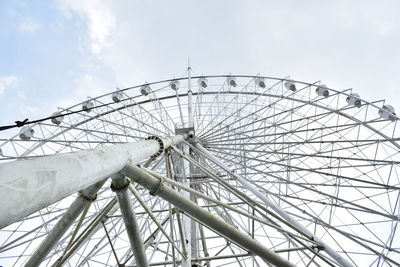 Low angle view of ferris wheel against sky