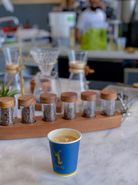 Close-up of coffee cups on table