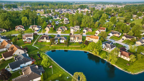 High angle view of townscape by lake