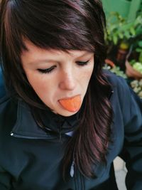 Portrait of teenage girl eating food
