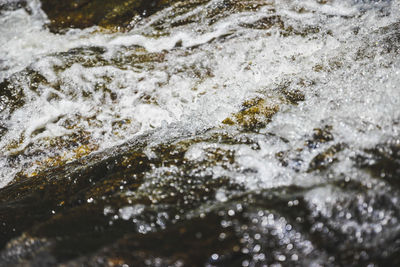 Close-up of water splashing on rocks