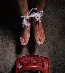 Low section of woman sitting on floor