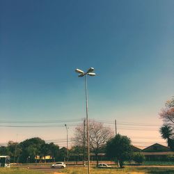 Street light against clear blue sky