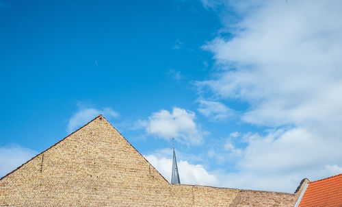 Low angle view of building against blue sky