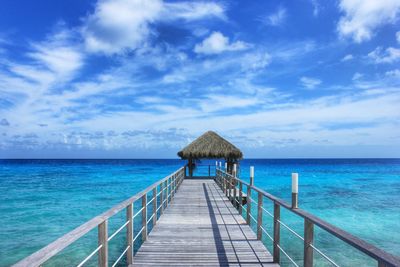 View of jetty leading to sea