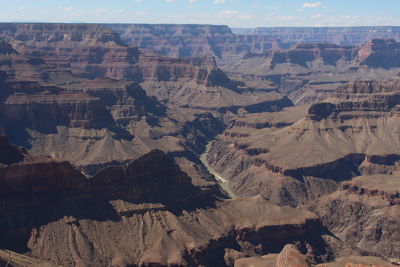 Aerial view of rocky mountains against sky