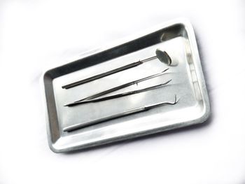 High angle view of piano keys on white table